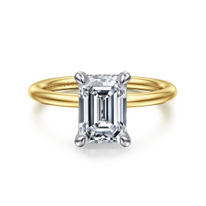 Gabriel & Co. ER16619E8M44JJ 14 karat white and yellow gold Classic engagement ring, front view of an emerald cut center held by four rounded claws on a thin smooth band
