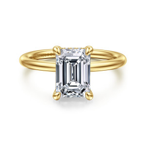 Gabriel & Co. ER16619E8Y44JJ 14 karat yellow gold Classic engagement ring, front view of an emerald cut center in four rounded claws on a smooth band
