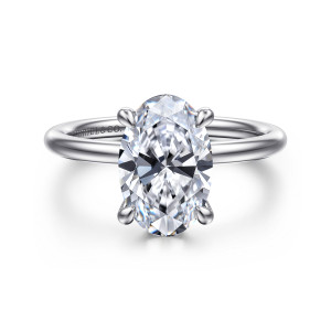 Gabriel & Co. ER16619O10W44JJ 14 karat white gold Classic engagement ring, front view of a plain solitaire, an oval center with four rounded prongs on a smooth band
