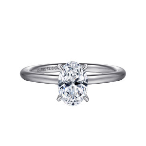 Gabriel & Co. ER16619O4W44JJ 14 karat white gold Classic engagement ring, front view of an oval center held on slender prongs above a plain polished band