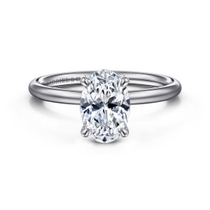 Gabriel & Co. ER16619O6W44JJ 14 karat white gold Classic engagement ring, front view of an oval center on slim claw prongs above a smooth polished band