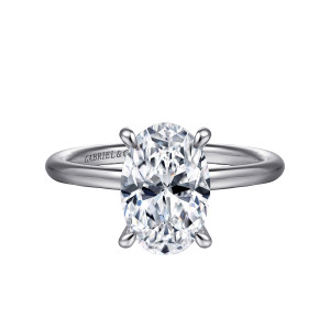 Gabriel & Co. ER16619O8W44JJ 14 karat white gold Classic engagement ring, front view of an oval center in four rounded tip prongs on a smooth stoneless band