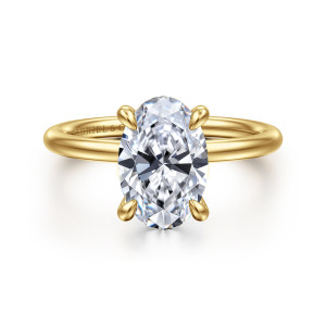 Gabriel & Co. ER16619O8Y44JJ 14 karat yellow gold Classic engagement ring, front view of an oval center gripped by four tapered claws on a smooth round band