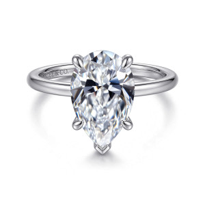 Gabriel & Co. ER16619P12W44JJ 14 karat white gold Classic engagement ring, front view of a pear shaped center with a V shaped prong guarding its pointed end