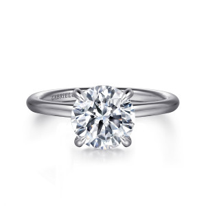 Gabriel & Co. ER16619R8W44JJ 14 karat white gold Classic engagement ring, front view of a round center on curved prongs above a plain polished band