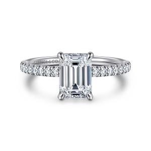 Gabriel & Co. ER16620E6W44JJ 14 karat white gold Classic engagement ring, front view of an emerald cut center in four claw prongs with small diamonds along the shoulders