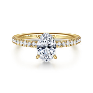 Gabriel & Co. ER16620O4Y44JJ 14 karat yellow gold Classic engagement ring, front view of an oval center with claw prongs and a row of small diamonds on each shoulder