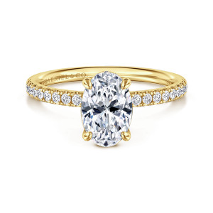 Gabriel & Co. ER16620O6Y44JJ 14 karat yellow gold Classic engagement ring, front view of an oval center on rounded prong tips with diamonds along the shoulders