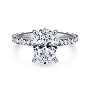 Gabriel & Co. ER16620O8W44JJ 14 karat white gold Classic engagement ring, front view of an oval center held by four prongs above a slim diamond band