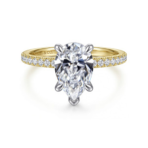 Gabriel & Co. ER16620P8M44JJ 14 karat white and yellow gold Classic engagement ring, front view of a pear shaped center held by flared claw prongs above a band of small diamonds
