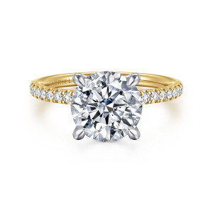 Gabriel & Co. ER16620R10M44JJ 14 karat white and yellow gold Classic engagement ring, front view of a round center held by four tapered prongs above a slim stone set band