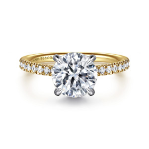 Gabriel & Co. ER16620R8M44JJ 14 karat white and yellow gold Classic engagement ring, front view of a round center held by four rounded prongs above small stones on the shoulders