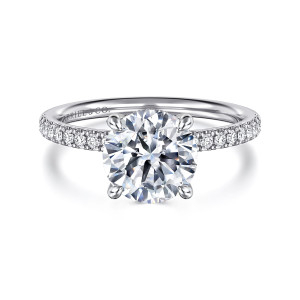 Gabriel & Co. ER16620R8W44JJ 14 karat white gold Classic engagement ring, front view of the round center between four rounded prongs with diamonds beside it on the band