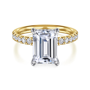 Gabriel & Co. ER16621E12M44JJ 14 karat white and yellow gold Contemporary engagement ring, front view of an emerald cut center in claw prongs with small diamonds along its top edge