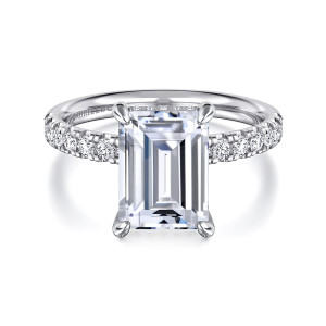 Gabriel & Co. ER16621E12W44JJ 14 karat white gold Contemporary engagement ring, front view of the emerald cut center in four claw prongs with round diamonds along both shoulders