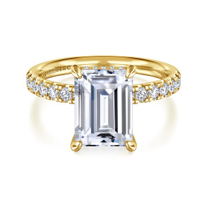 Gabriel & Co. ER16621E12Y44JJ 14 karat yellow gold Contemporary engagement ring, front view of an emerald cut center between two runs of round diamonds on the shoulders