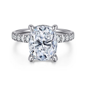Gabriel & Co. ER16621G16W44JJ 14 karat white gold Contemporary engagement ring, front view of an elongated cushion center in teardrop tipped claws above a band of round diamonds