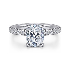 Gabriel & Co. ER16621G8W44JJ 14 karat white gold Contemporary engagement ring, front view of an elongated cushion center with pave diamonds running along both shoulders