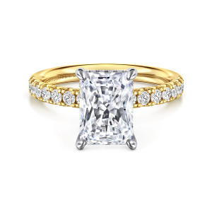 Gabriel & Co. ER16621N10M44JJ 14 karat white and yellow gold Contemporary engagement ring, front view of a radiant cut center in four cooler toned prongs above a diamond set band