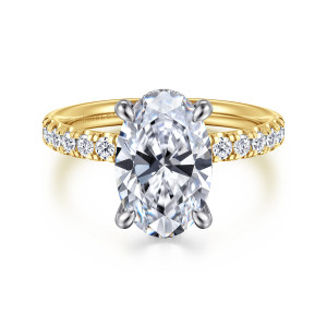 Gabriel & Co. ER16621O12M44JJ 14 karat white and yellow gold Contemporary engagement ring, front view of an oval center in four cooler toned prongs above a diamond lined band
