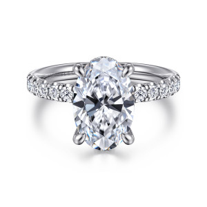 Gabriel & Co. ER16621O12W44JJ 14 karat white gold Contemporary engagement ring, front view of an oval center between lines of small diamonds set in scalloped settings on the band