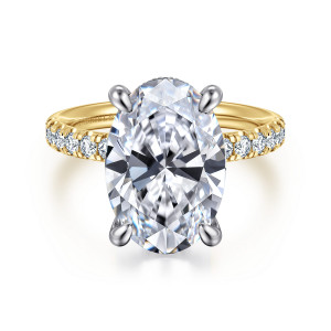 Gabriel & Co. ER16621O20M44JJ 14 karat white and yellow gold Contemporary engagement ring, front view of an oval center on claw prongs above a band of small round diamonds