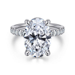Gabriel & Co. ER16621O20W44JJ 14 karat white gold Contemporary engagement ring, front view of the tall oval center in curved claws with small diamonds along the band