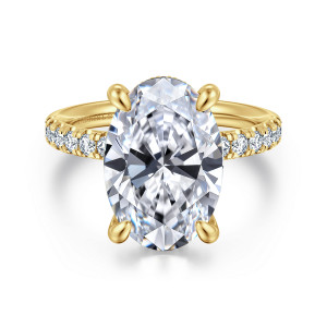 Gabriel & Co. ER16621O20Y44JJ 14 karat yellow gold Contemporary engagement ring, front view of a large oval center on rounded claws with pave stones along the shoulders