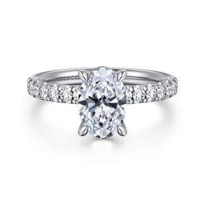 Gabriel & Co. ER16621O6W44JJ 14 karat white gold Contemporary engagement ring, front view of an upright oval between rows of round diamonds in scalloped settings on the shoulders