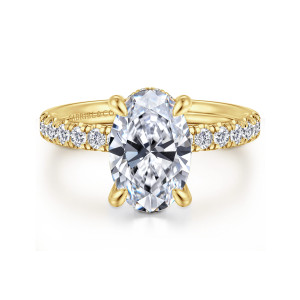 Gabriel & Co. ER16621O8Y44JJ 14 karat yellow gold Contemporary engagement ring, front view of an oval center held by four teardrop prongs above small diamonds on both shoulders