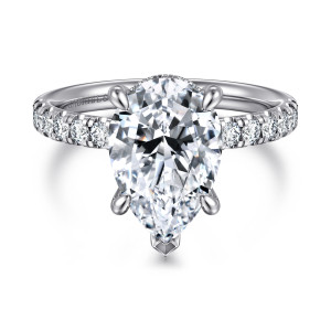 Gabriel & Co. ER16621P12W44JJ 14 karat white gold Contemporary engagement ring, front view of a pear shaped center, a shield tipped point prong, and diamonds beside the head
