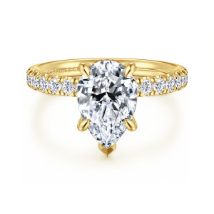 Gabriel & Co. ER16621P8Y44JJ 14 karat yellow gold Contemporary engagement ring, front view of a pear shaped center with a pointed V tip and diamonds along both shoulders