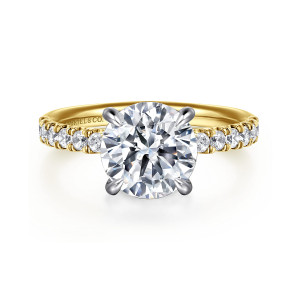 Gabriel & Co. ER16621R12M44JJ 14 karat white and yellow gold Contemporary engagement ring, front view of a round center held by four claw prongs with round diamonds on the shoulders