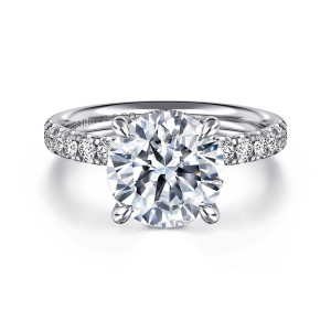 Gabriel & Co. ER16621R12W44JJ 14 karat white gold Contemporary engagement ring, front view of a round center with four teardrop prongs and shared prong diamonds along the shoulders