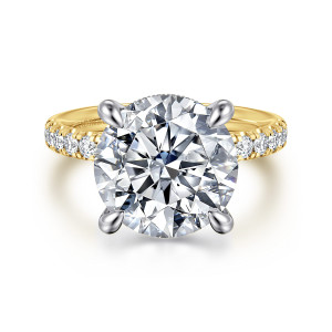 Gabriel & Co. ER16621R20M44JJ 14 karat white and yellow gold Contemporary engagement ring, front view of a round center in four claws with scalloped pave on both shoulders of the band