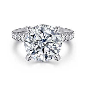 Gabriel & Co. ER16621R20W44JJ 14 karat white gold Contemporary engagement ring, front view of a round center in teardrop tipped claws with diamonds along the shoulders