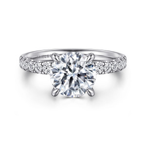 Gabriel & Co. ER16621R8W44JJ 14 karat white gold Contemporary engagement ring, front view of a round center with four rounded claw tips and stones flanking it along the band