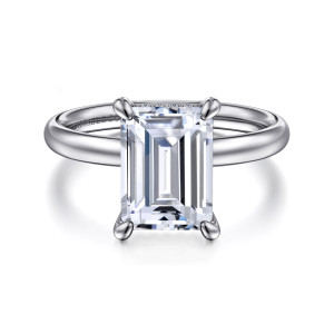 Gabriel & Co. ER16622E10W44JJ 14 karat white gold Classic engagement ring, front view of an emerald cut center in rounded claws on a plain band