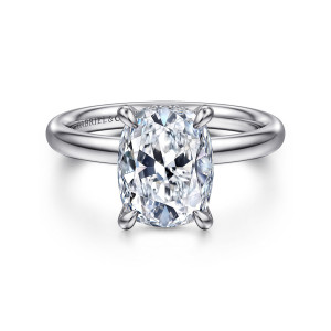 Gabriel & Co. ER16622G12W44JJ 14 karat white gold Classic engagement ring, front view of an elongated cushion center held by four claws on a smooth rounded band