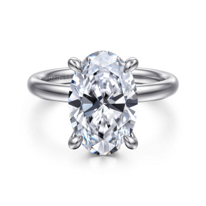 Gabriel & Co. ER16622O16W44JJ 14 karat white gold Classic engagement ring, front view of an oval center held by rounded claws on a smooth plain band