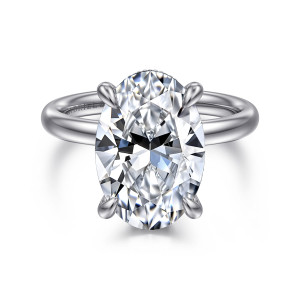 Gabriel & Co. ER16622O20W44JJ 14 karat white gold Classic engagement ring, front view of an oval center held by four teardrop tipped claws on a smooth rounded band