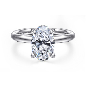 Gabriel & Co. ER16622O8W44JJ 14 karat white gold Classic engagement ring, front view of an oval center with claw prongs at its ends above a plain rounded band