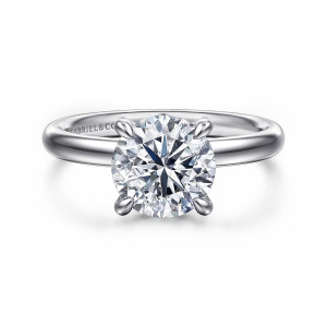Gabriel & Co. ER16622R8W44JJ 14 karat white gold Classic engagement ring, front view of a round center in slender claws above a smooth, plain band