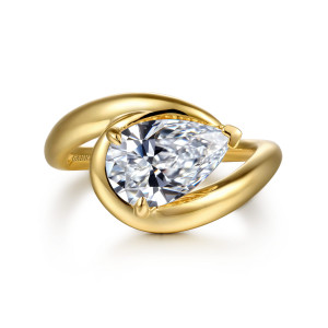 Gabriel & Co. ER16640P8Y4JJJ 14 karat yellow gold Contemporary engagement ring, front view of a pear shaped center lying sideways inside the sweep of a smooth bypass band