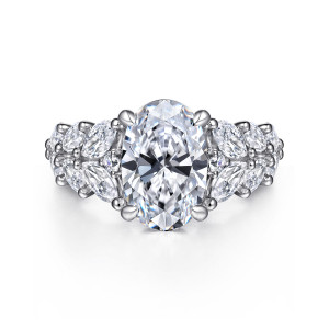 Gabriel & Co. ER16641O12W44JJ 14 karat white gold Starlight engagement ring, front view of an oval center framed by leaf like elongated stones on each side