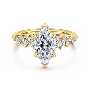 Gabriel & Co. ER16665M6Y44JJ 14 karat yellow gold Starlight engagement ring, front view of a marquise center with V capped tip prongs and staggered diamonds on both shoulders
