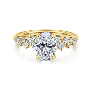 Gabriel & Co. ER16665O6Y44JJ 14 karat yellow gold Starlight engagement ring, front view of an oval center flanked by staggered round diamonds on both shoulders