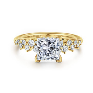 Gabriel & Co. ER16665S6Y44JJ 14 karat yellow gold Starlight engagement ring, front view of a princess cut center with staggered round diamonds on both shoulders