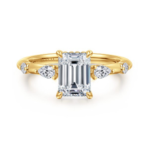 Gabriel & Co. ER16666E6Y84JJ 18 karat yellow gold Starlight engagement ring, front view of the emerald cut center with claws at each corner and spaced stones on both shoulders