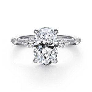 Gabriel & Co. ER16666O8W44JJ 14 karat white gold Bujukan engagement ring, front view of an oval center flanked by elongated stones and small round stones